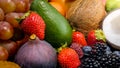 Closeup photo of tropical and exotic fruits. Berries, cocnuts, grapes, figs and avocado. Royalty Free Stock Photo
