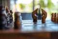 Two horses on wooden chessboard game Royalty Free Stock Photo