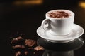 Closeup image of white cup full of cocoa with milk