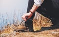 A woman hiker tying shoelaces and getting ready for trekking on the top of mountain Royalty Free Stock Photo
