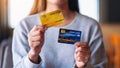 A woman holding and showing credit cards Royalty Free Stock Photo