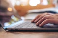 Woman`s hands using and typing on laptop keyboard on the table Royalty Free Stock Photo