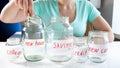 Closeup image of young woman choosing saving money for buying new house Royalty Free Stock Photo