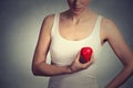 Closeup image young woman holding red drop of blood