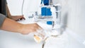 Closeup photo of young woman washing dirty stained sink in bathroom Royalty Free Stock Photo