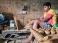 Closeup of Indian Child or kid pot making in a shed