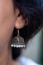 Closeup Indian girl wearing Jhumka or Jhumki, an Indian Style Earrings