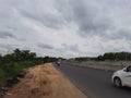 Closeup of Indian National highway road from Bangalore to Mysore and local colorful bus