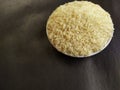 Closeup, Indian rice on a plate, Black background.
