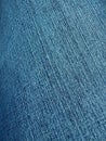 A Closeup of Indigo Blue Denim Fabric on the Diagonal. Royalty Free Stock Photo