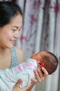 Closeup infant baby in mother arms