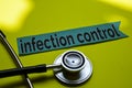 Closeup infection control with stethoscope concept inspiration on yellow background