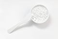 Closeup ingredient for alginate cosmetic mask and paddle for applying it on white background.