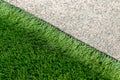 Closeup installation of football field with artificial turf with grass. Close up of line of an artificial football field. Details