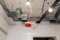 Closeup installation and repair of electric cable, smoke detector, fire alarm system before installing stretch or suspended Royalty Free Stock Photo