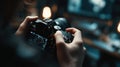 Closeup of instructor demonstrating camera settings in a dim indoor studio the lens and controls clearly focused while Royalty Free Stock Photo