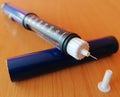 Closeup of insulin pen with needle for insulin injection for  diabetics. World diabetes day. Royalty Free Stock Photo