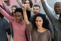 Closeup of international group of activists protesting outdoors