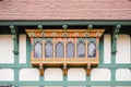 closeup of intricate woodwork on tudor front gable