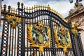 Closeup of the iron decorations on the gates of Buckingham Palace in the center of London, England. Royalty Free Stock Photo