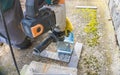 Closeup of iron support on a wooden pillar on the construction site with screw. Royalty Free Stock Photo