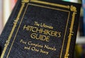 Closeup of isolated Douglas Adams hitchhikers guide through the galaxy book cover