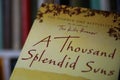 Closeup of isolated Khaled Hosseini bestseller a thousand splendid suns book cover
