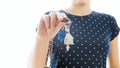 Closeup isolated photo of young woman showing keys from new house Royalty Free Stock Photo