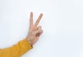 Closeup of isolated on white background adult male hand counting to two or showing peace sign. Math or peace concept. Isolated. Royalty Free Stock Photo