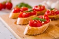 Closeup of Italian bruschetta with tomato, basil and garlic Royalty Free Stock Photo