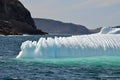 Closeup of jagged iceberg marooned along the coastline
