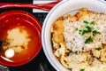 Closeup Japanese food ,Katsudon is Japanese fast food bowl of rice topped with fried pork cutlet and eggs with soup Royalty Free Stock Photo