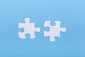 Closeup of jigsaw puzzle on blue background Missing jigsaw puzzle piece, business concept for completing the piece Royalty Free Stock Photo