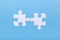 Closeup of jigsaw puzzle on blue background Missing jigsaw puzzle piece, business concept for completing the piece Royalty Free Stock Photo