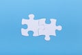 Closeup of jigsaw puzzle on blue background Missing jigsaw puzzle piece, business concept for completing the piece Royalty Free Stock Photo