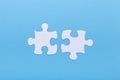 Closeup of jigsaw puzzle on blue background Missing jigsaw puzzle piece, business concept for completing the piece Royalty Free Stock Photo