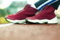 Closeup of jogger feet in red running shoes