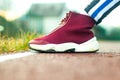 Closeup of jogger feet in red running shoes