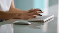 Closeup journalist hands typing wireless keyboard creating article at office. Royalty Free Stock Photo