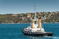 Closeup of Karoo tugboat on blue bay water in Sydney, Australia