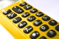 Closeup on keypad of a yellow hand-held phone Royalty Free Stock Photo