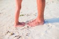 Closeup kids and adult feet on white sandy beach Royalty Free Stock Photo