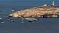 Closeup of King Air B200 flying over the sea passing by St. Paul Island