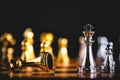 Closeup king chess piece defeated enemy or trade competitor by checkmate at end of chessboard game. Businessman moving chess to