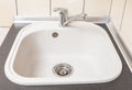 Closeup of Kitchen Marble Sink and Installed New Faucet Royalty Free Stock Photo