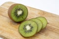 Closeup Kiwi fruit slice on the old wood butcher