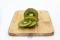 Closeup Kiwi fruit slice on the old wood butcher Royalty Free Stock Photo