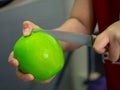 Closeup knife slice on holding pickle guava