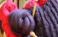 Closeup of knitted colorful purple pink blanket, ball of merino wool, knitting needles Royalty Free Stock Photo