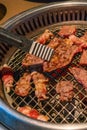 Closeup of Korean barbecue beef slice grilled over charcoal stove